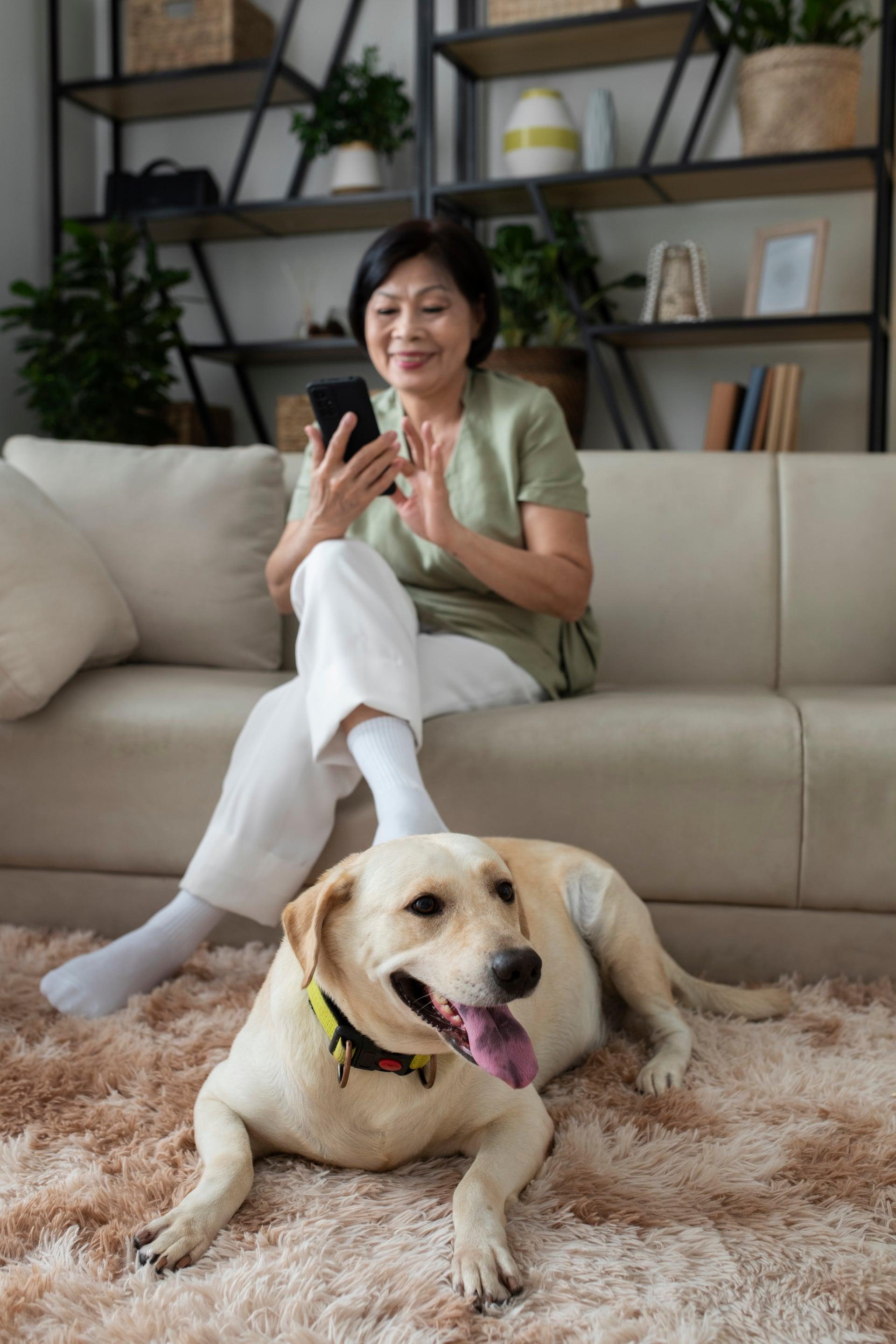 woman sit on sofa with dog